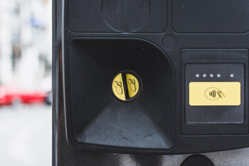 Parking meter slot for coins also the contactless payment as an alternative