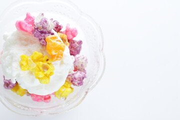 Multiple color popcorn on vanilla ice-cream