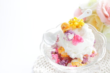 Multiple color popcorn on vanilla ice-cream