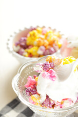 Multiple color popcorn on vanilla ice-cream