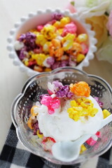 Multiple color popcorn on vanilla ice-cream