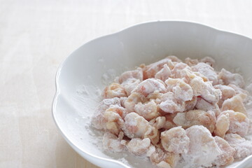 Chinese cooking, corn starch mixed with Chicken soft bone prepared for deep frying