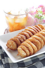 Korean street food, fried potato with spicy salt and iced tea