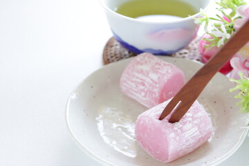Japanese Cherry blossom color Mochi confectionery and green tea