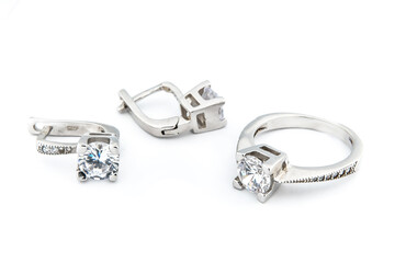 Silver jewels collection with crystals in minimalism style. Silver set of earrings and silver necklace