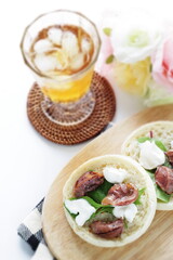 Canned food, smoked chicken gizzard and cream cheese in English muffin sandwich