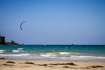 Obraz na płótnie Canvas Kitesurfer on sea in Saint-Malo city, Brittany, France