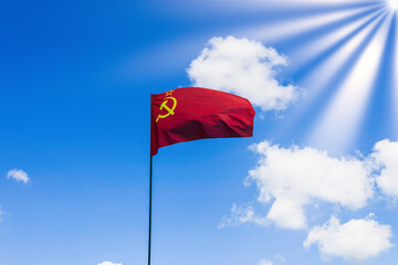 CCCP USSR Soviet Union flag waving in the blue cloudy sky