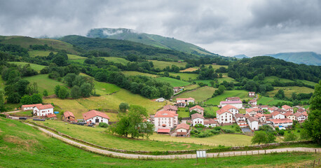 Fototapeta premium panoramic view of pyrenees mountains and countryside town, spain