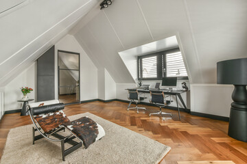 Spacious bright attic room for work and relaxation with a beautiful view from the window