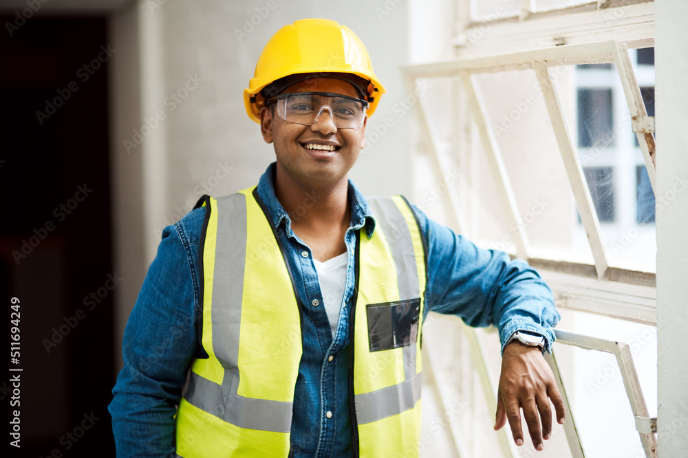 Poster if you can dream it, i can build it. shot of a engineer wearing protective gear on a construction si