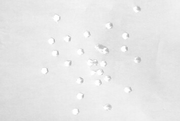 Small holes in white paper, isolated