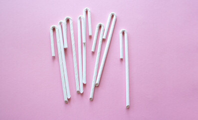 Cocktail Straws Day. Paper drinking straws on a pink background. Summer cocktail party, a fun and cheerful holiday concept