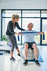 I can do this with no pain. Full length shot of a female physiotherapist helping a senior man...