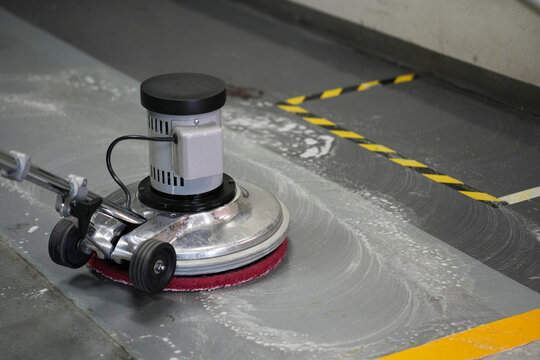 The people cleaning wash exterior walkway using polishing machine, clean equipment concept