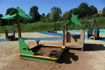 Fototapeta na wymiar Playground with sandbox in the city park