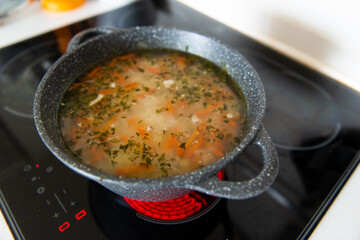 national soup in a cauldron on the stove
