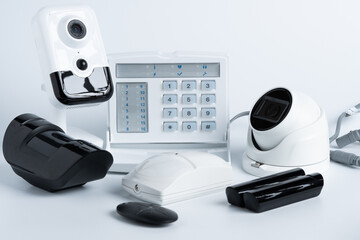 Various security system equipment on white background.