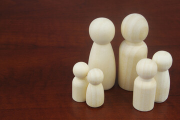 People figures as family members with copy space for text.  Concept of classic traditional family, unity, togetherness and relationship. 