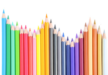 colored pencils lined on a white background