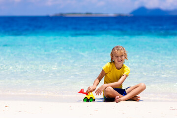 Kids playing on beach. Children play at sea.