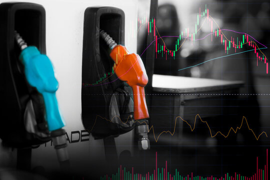 Graph of the stock market oil price with pump nozzle background. Concept oil trend up and down on market world. Oil shortage in market.