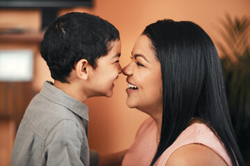 There is tenderness in the love of a mother to a son. Shot of a mother and her little son bonding together at home.
