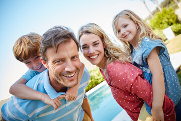 The joys of family life. Portrait of a happy family enjoying a day outdoors together.