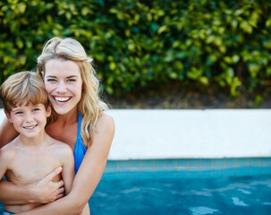 Fototapeta na wymiar These are the moments that count. Portrait of a mother and son swimming in a pool together.