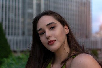 Portrait of attractive young woman gazing positively
