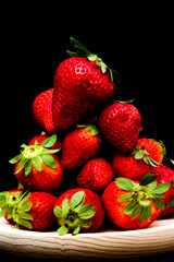 Fresh strawberries on black background
