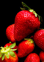Fresh strawberries on black background