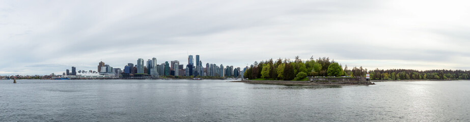 Fototapeta na wymiar Panoramic View of Coal Harbour, Canada Place and Stanley Park. Cloudy Evening Sky. Downtown Vancouver, British Columbia, Canada.