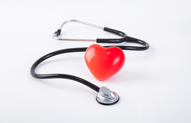 stethoscope and heart on blue background