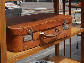 Flea market. Second hand suitcase for sale.