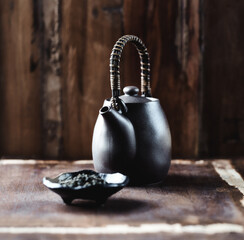 Traditional, handcrafted ceramic on dark wooden background. Soft focus. Close up.