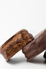 Sliced chocolate alfajor with dulce de leche.