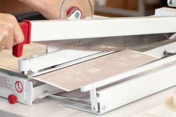 close-up manual guillotine knife blade for paper cuts laminated leaflet, flyers.