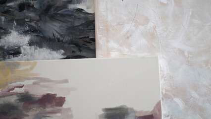 Artistic. Closeup view of three abstract modern painting. Beautiful color palette and brushwork...