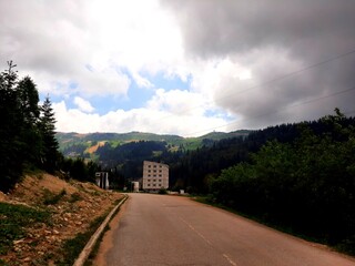 Road to Jahorina ski centre, mountain Jahorina landscape with forest and clouds, Bosnia and Herzegovina