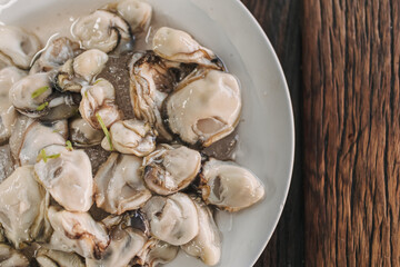 Thai seafood Fresh Oyster with three sauces served on ice.