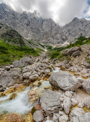 Water stream under the north wall of Triglav mountain
