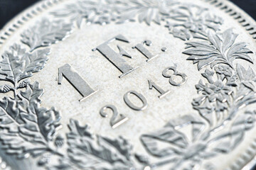 1 Swiss Franc coin closeup. Illustration about economy, business or banking. Money and Central Bank in Switzerland. Macro