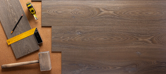 Wood laminate background and tools on floor texture. Wooden laminate
