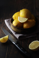 A bowl with yellow bright lemons