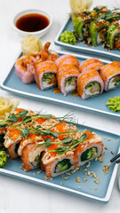 Japanese cuisine. Rolls with salmon on a white table.

