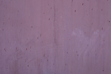 Old wooden board. Background in form of gray metal-painted decorative wall with spots and markers from age.