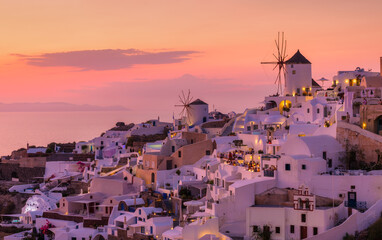 Oia village, Santorini, Greece. View of traditional houses in Santorini. Small narrow streets and...