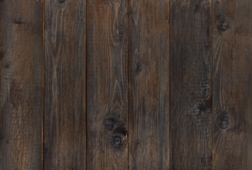 natural dark wooden background. black textured boards.