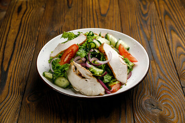 European cuisine. salad on a wooden table
